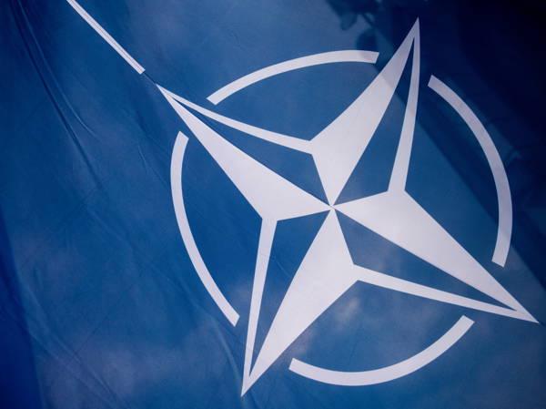 NATO says a record of more than 20 allies are expected to hit alliance’s target for defense spending this year