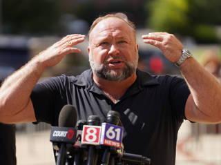 Alex Jones breaks sobs on Infowars show claiming feds are trying to shutter show