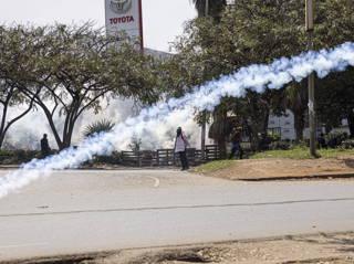 Pro- and anti-government protesters clash in Kenya as police hurl tear-gas cannisters