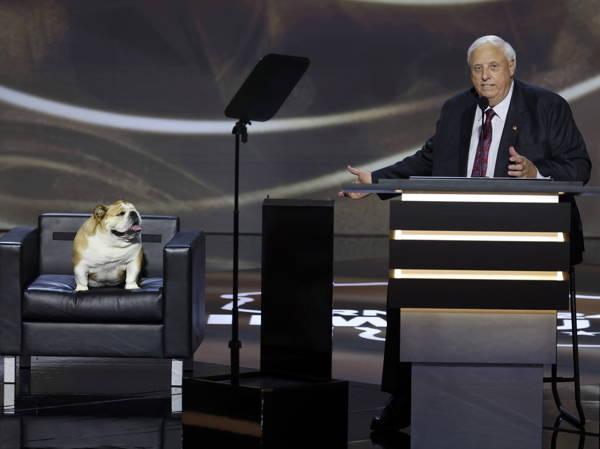 West Virginia Gov. Jim Justice appears on convention stage with pet bulldog Babydog