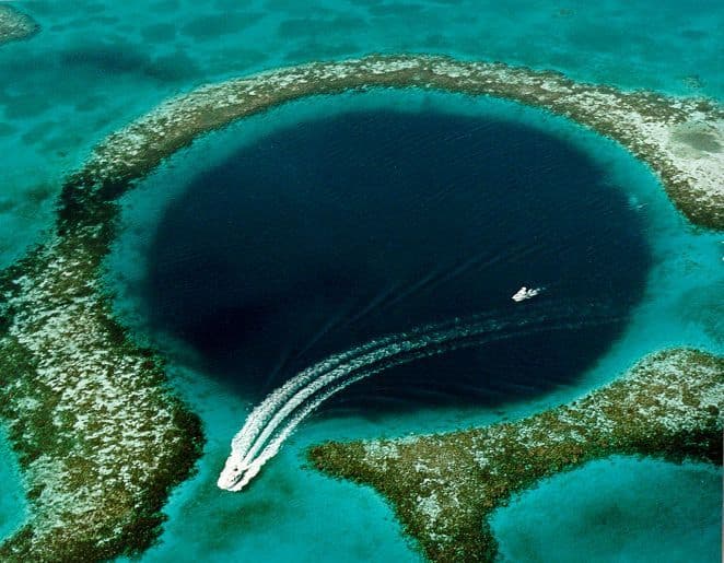 Wikipedia Photo - Source: [1], fetched September 2006. Caption on this USGS web page was, "Blue Hole: Aerial view of the 400-ft-deep oceanic blue hole (Lighthouse Reef Atoll Blue Hole) located east of Belize." (By: U.S. Geological Survey (USGS))