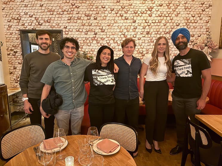 Ground News team standing together in a restaurant