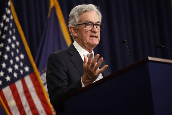 Fed hikes rates by a quarter percentage point, indicates increases are near an end