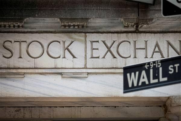 Stocks fall, bond yields tumble after Fed's latest rate hike