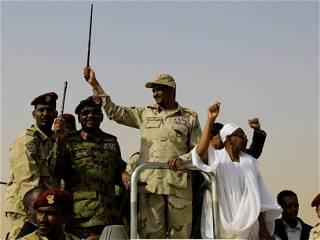 Gunfire erupts in Sudan; paramilitary group claims to seize palace