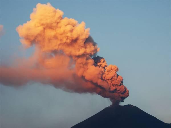 Mexico raises warning alarm for Popocatepetl volcano as it spews smoke, ash and molten rock