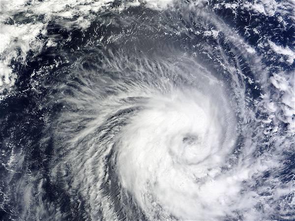 Super Typhoon Mawar passing over Guam as Category 4 storm with strong winds, rain