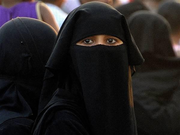 Swiss parliament approves ban on full-face coverings like burqas, and sets fine for violators