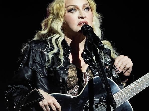 Madonna awkwardly falls off a chair during Seattle concert