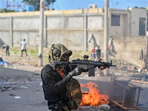 Gunfire paralyzes Haiti as powerful gang leader says he will try to detain police chief, ministers