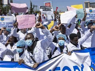 Hundreds of Kenyan doctors protest in the streets as national strike enters second week