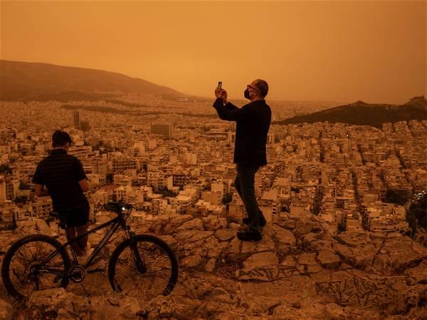 Skies over Athens turn 'apocalyptic' orange from Sahara dust storm