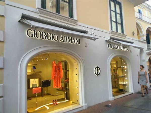 Giorgio Armani bags were produced by exploited Chinese workers near Milan, Italian police say