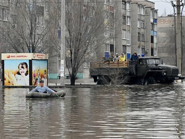 Russians stage a rare protest after a dam bursts and homes flood near the Kazakh border