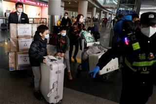 Chinese rush to renew passports as COVID border curbs lifted