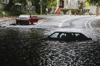 High winds, torrential rains lash California, killing at least two