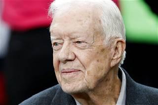 Jimmy Carter receives accolades from afar, and right at home