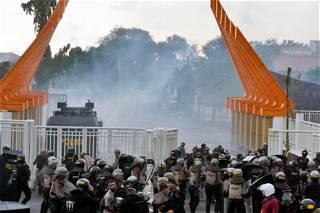 Indonesian police fire tear gas to disperse soccer fans