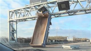 M5 closed near Bristol after crash leaves tipper truck rear wedged in the air against gantry