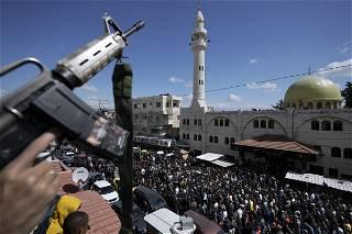 Palestinian police fire tear gas, disperse militant funeral
